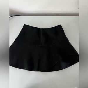 Zara Woman black miniskirt, size small, zipper on the right side, elastic waist.